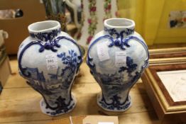 A pair of Delft style blue and white vases.