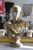 A painted plaster bust of Julius Caesar.