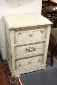 A decoratively painted three drawer pedestal chest.
