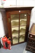 A 19th century oak hanging corner cabinet.