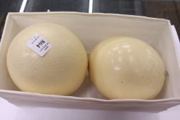 Two ostrich eggs.