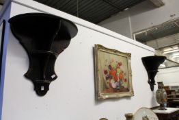 A pair of decoratively painted wall shelves.