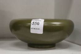 A Chinese green glazed circular brush washer.