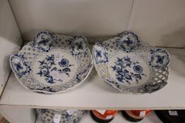 A pair of Meissen blue and white porcelain baskets with pierced sides.