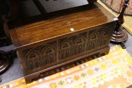 A small carved oak coffer.