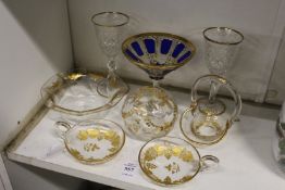 A pair of engraved and gilt decorated wine tasters, similar bowl, vase and basket together with a