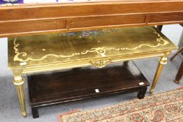 A decorative gilt wood coffee table.