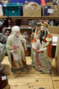 A pair of Chinese porcelain figures.