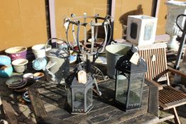 Garden lanterns, a watering can etc.