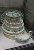 A quantity of Wedgwood plates etc. with pale green leaf decoration.