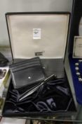 A boxed Mont Blanc pen and card case.