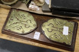 A Victorian brass and oak sliding book stand.