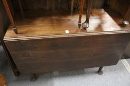 A George III mahogany drop leaf gate leg dining table.