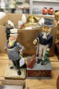 A Bretby porcelain Mr Micawber lamp base and a novelty cast metal money box.