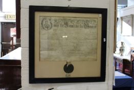A large framed and glazed indenture.