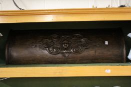 An unusual carved oak bow fronted panel.