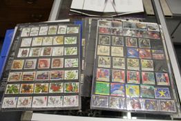 Stamps, a blue folder containing numerous pages of mint Decimal GB and year packs.