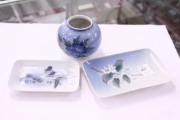 Two Royal Copenhagen pin trays and a small vase.