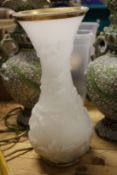 An opaque moulded glass baluster shaped vase with gilded decoration.