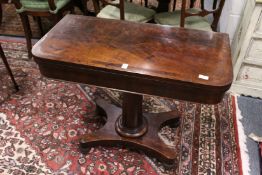 A 19th century mahogany foldover card table.