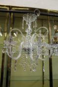A Venetian style glass six branch chandelier.