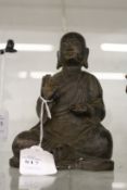A bronze seated Buddha.