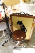 A tripod table, a wrought iron standard lamp base and a fire screen.