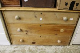 A pine three drawer chest.