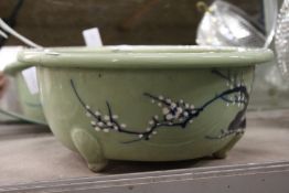 A large Celadon glazed Chinese planter.
