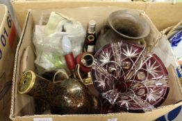 A cut glass vase and other decorative items.