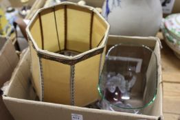 A glass dome, a pair of glass lights and a lamp.