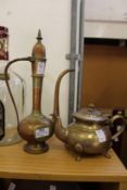 An eastern brass ewer and a similar teapot.