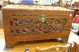 A Chinese carved camphor wood coffer.