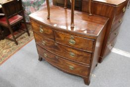 A small 19th century mahogany bow front chest of two short and two long drawers on splay bracket