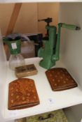A pair of leather folding bookends, an old mincer and a Jubilee jug.