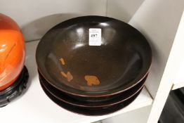Three Chinese lacquer bowls.