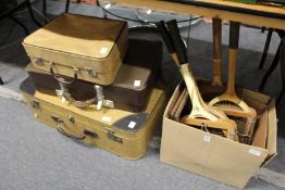 Old tennis racquets and suitcases.