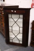 A 19th century mahogany hanging corner display cabinet.