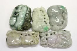 Five Chinese carved jadeite amulets.