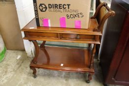 A two tier trolley a drawer.