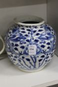 A Chinese blue and white jar painted with dragons.