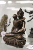 An eastern bronze erotic figure group.