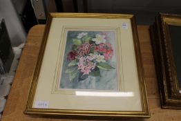 A small watercolour of flowers in a vase and a pair of prints depicting French armchairs.