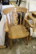 A Windsor style beech framed kitchen chair.