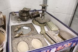 A small silver mug, silver photograph frame, dressing table items etc.