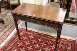 A good George III design mahogany rectangular foldover tea table with a blind fret decorated