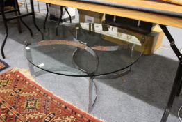 A glass and chrome coffee table.