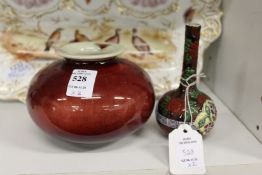 A small Chinese flambe glazed bowl and a small bottle vase.
