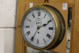 A ship's style brass cased clock.