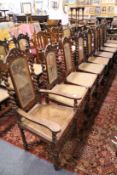 A set of twelve early 20th century Indian rosewood dining chairs, two with arms, each with